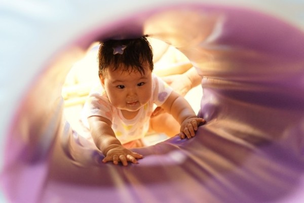 baby going through a tunnel