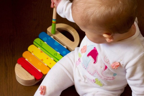 baby with a musical instrument