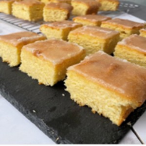 Slices of lemon drizzle cake for pre-schoolers to eat