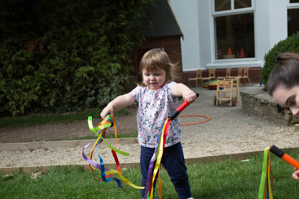 Sensory play using ribbons at nursery