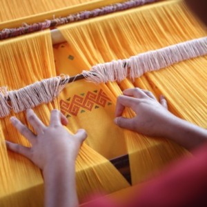 Children weaving in activity