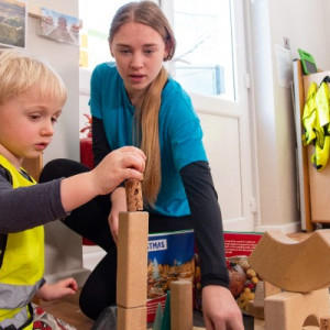 A child building bricks as part of a construction activity at nursery