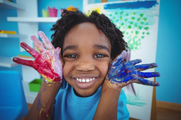 boy with coloured hands