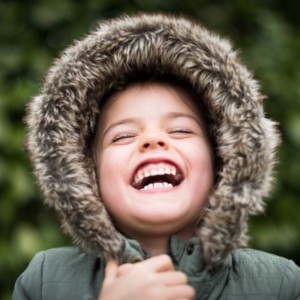 a young boy laughing